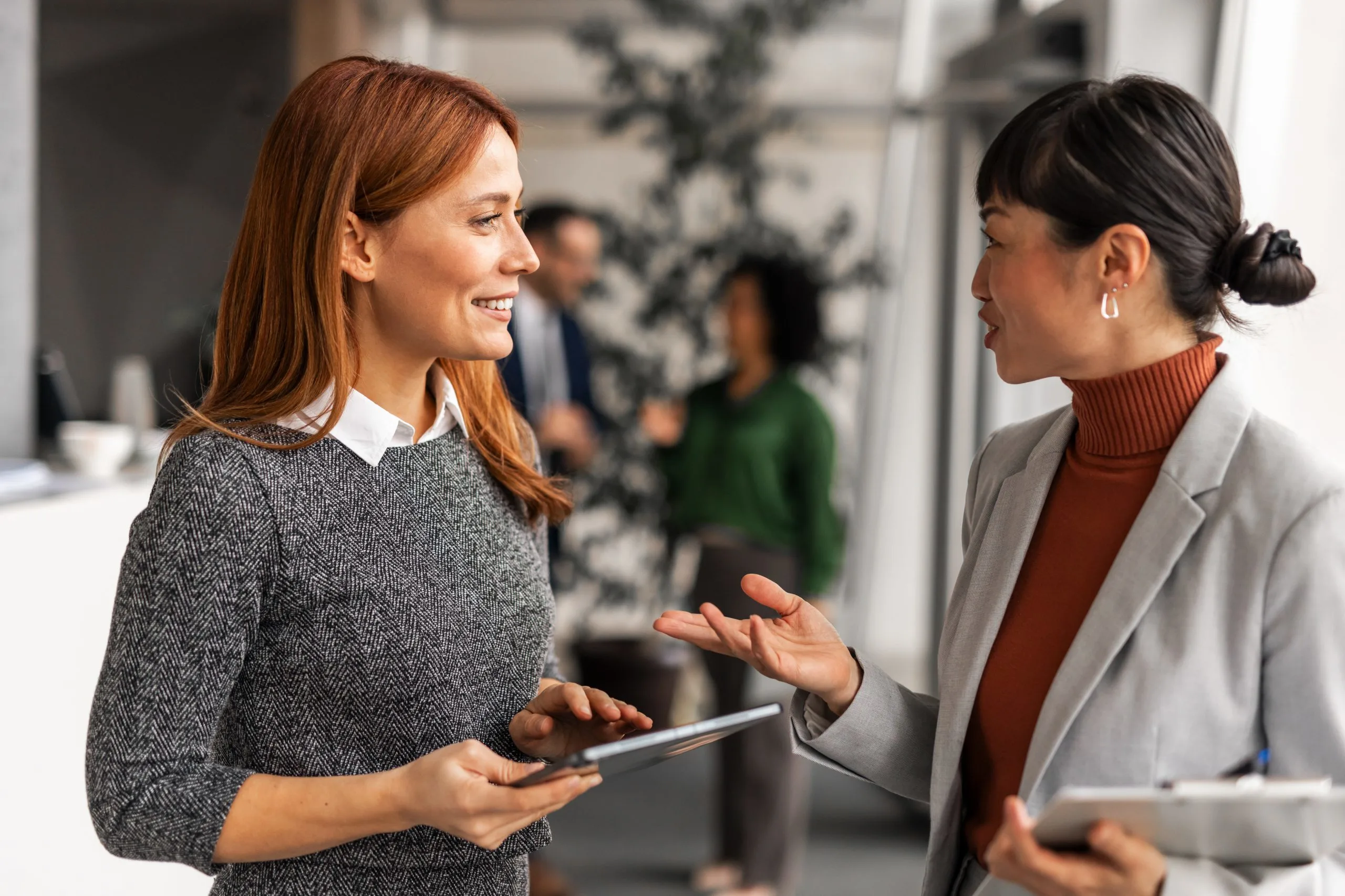 female professionals office discussion
