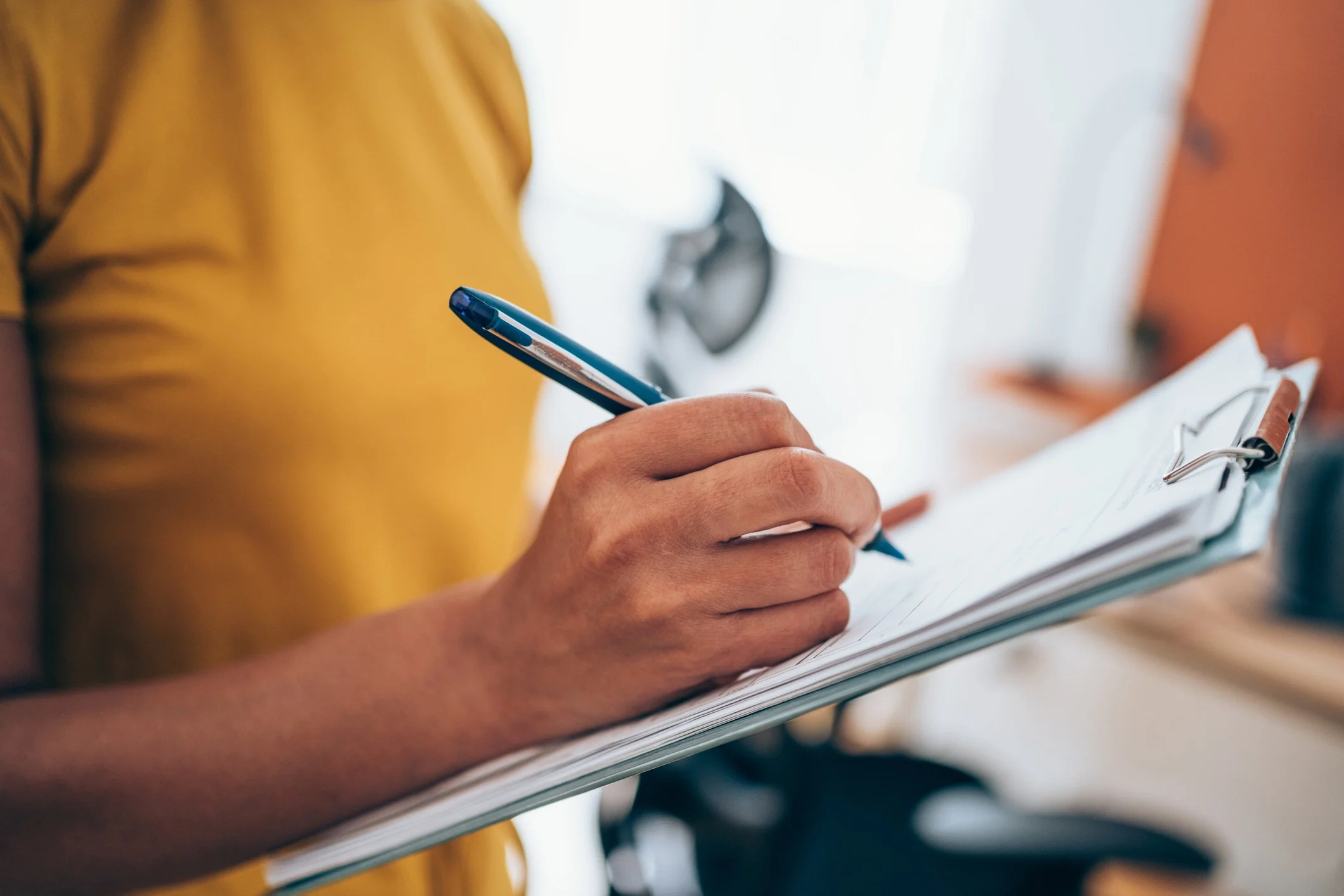 woman filling out property inspection checklist